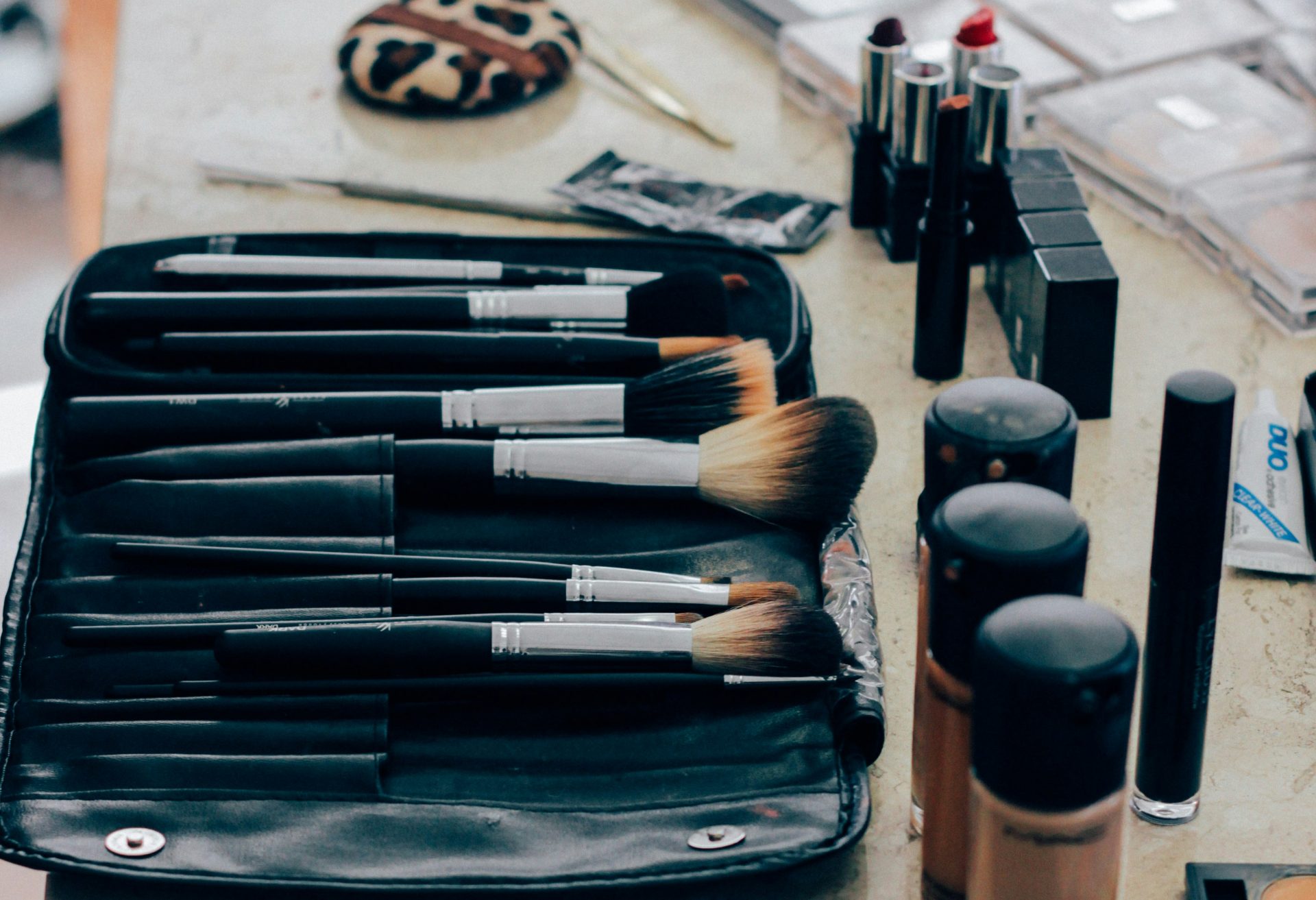 Makeup brushes neatly displayed with cosmetics